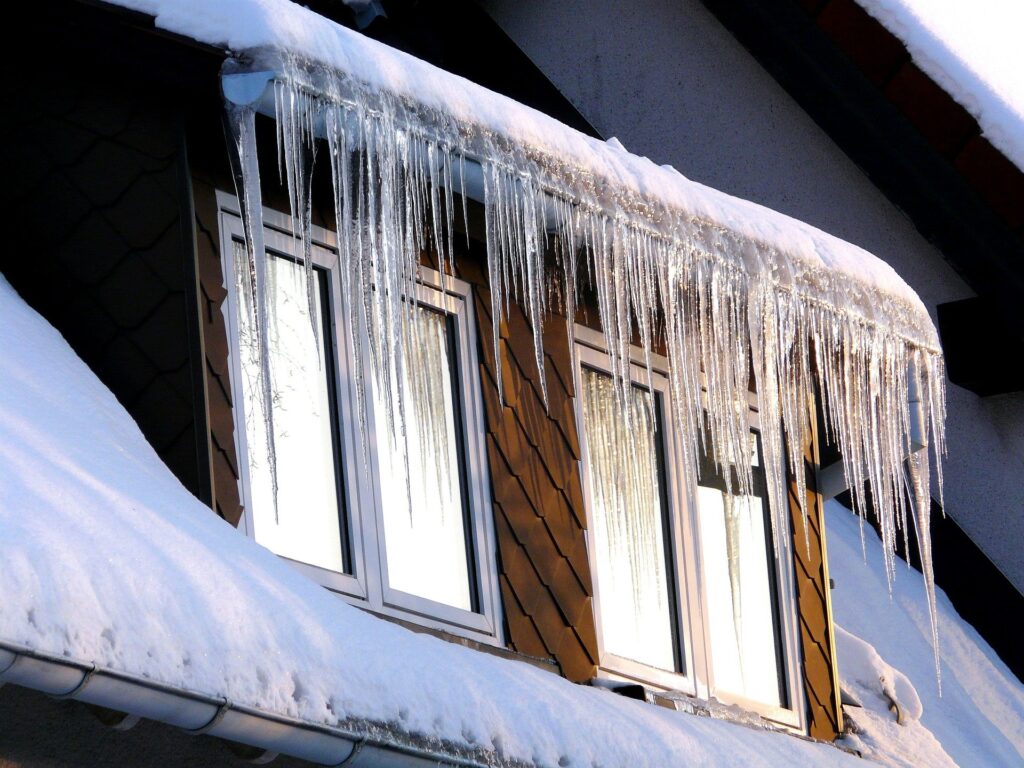 What causes icicles on houses